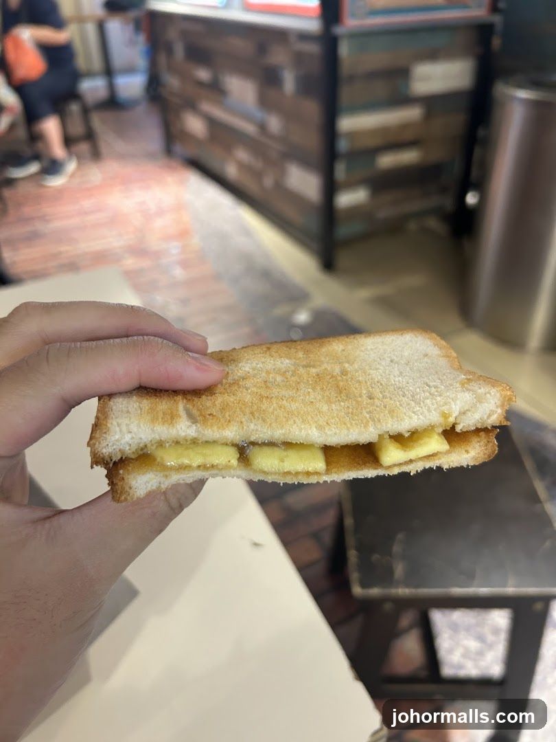 Hand holding sandwich