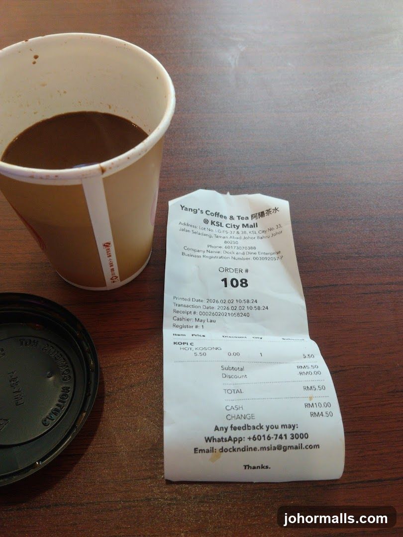 Yang's Coffee & Tea receipt and coffee cup
