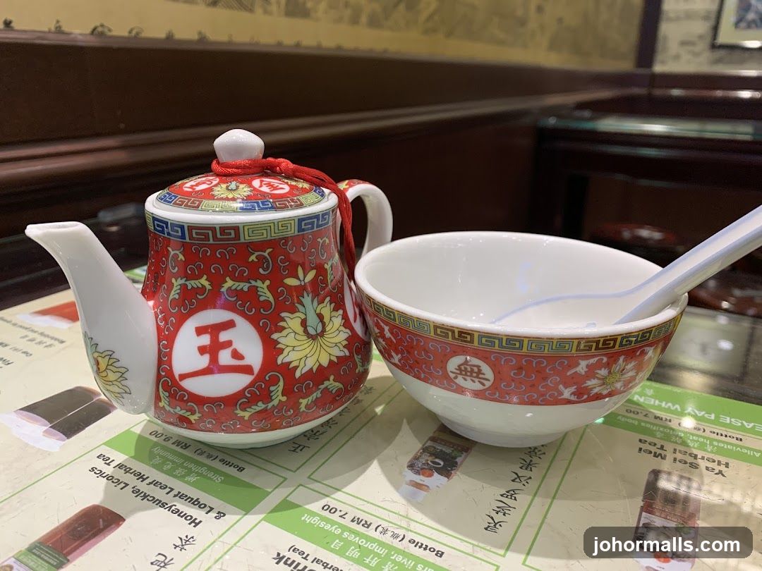 Tea set on table with menu