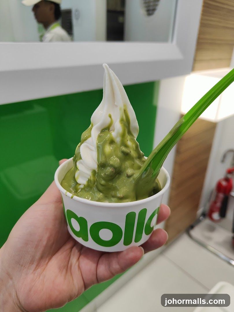 Hand holding a soft serve dessert