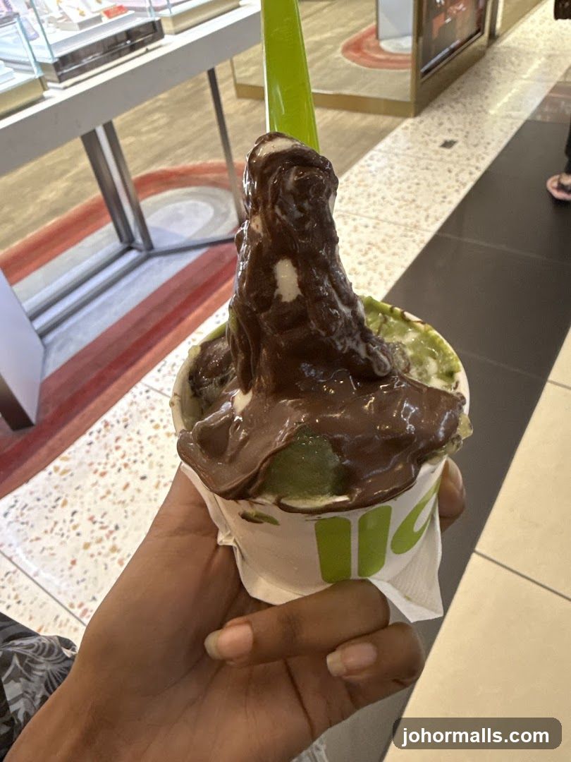 Hand holding ice cream dessert