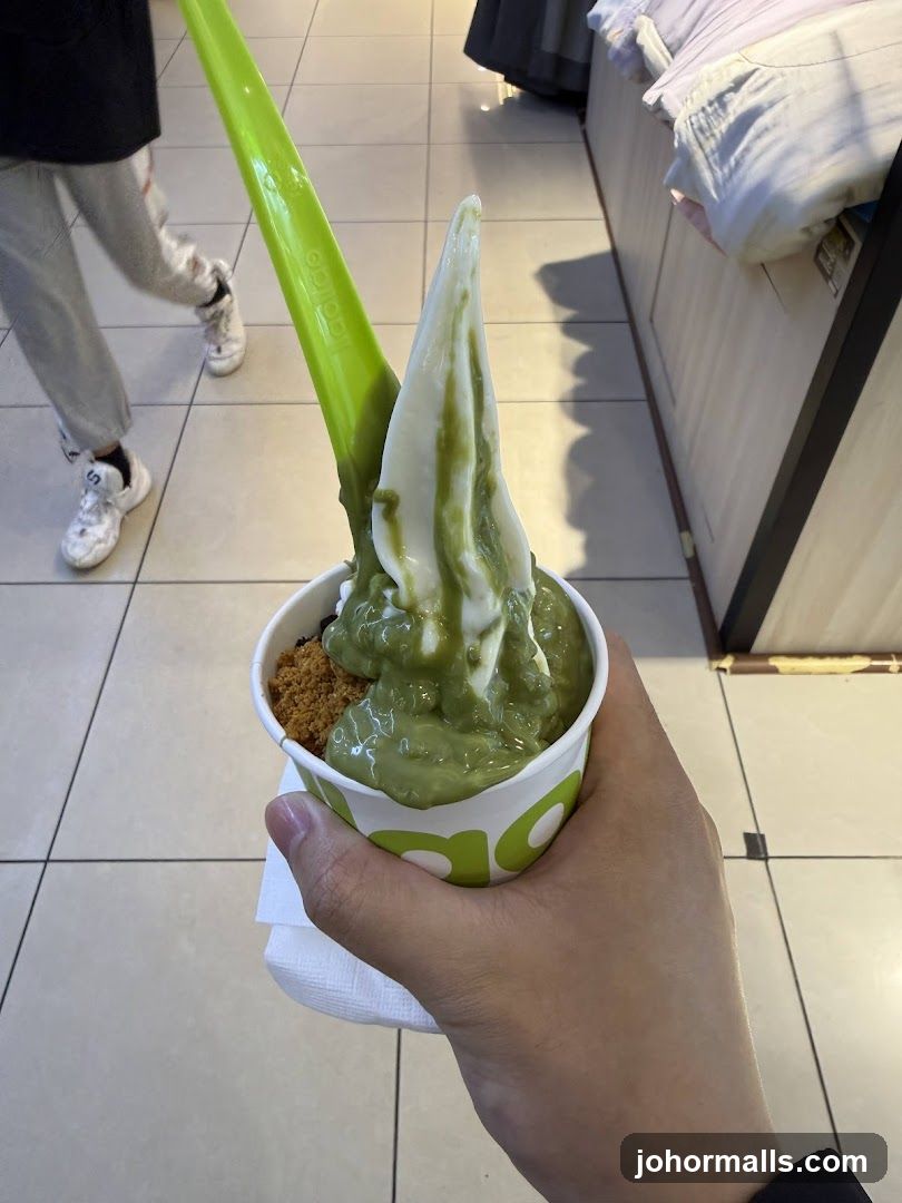 Hand holding soft serve dessert
