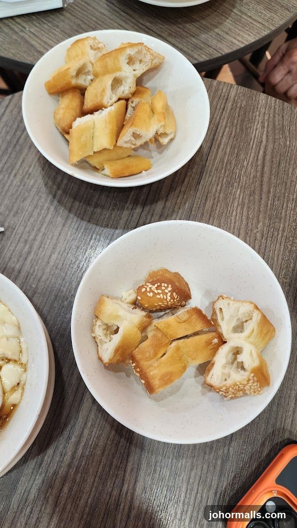 Bread served in bowls on wooden table