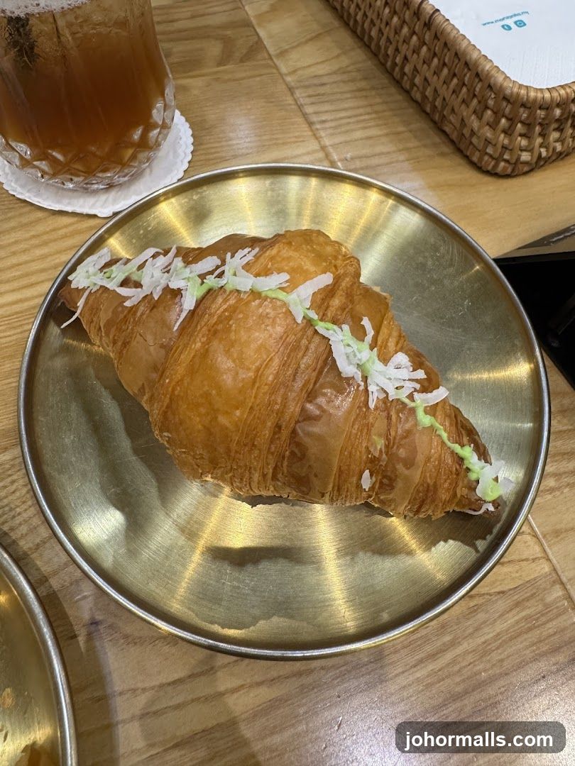 Croissant on Metal Plate
