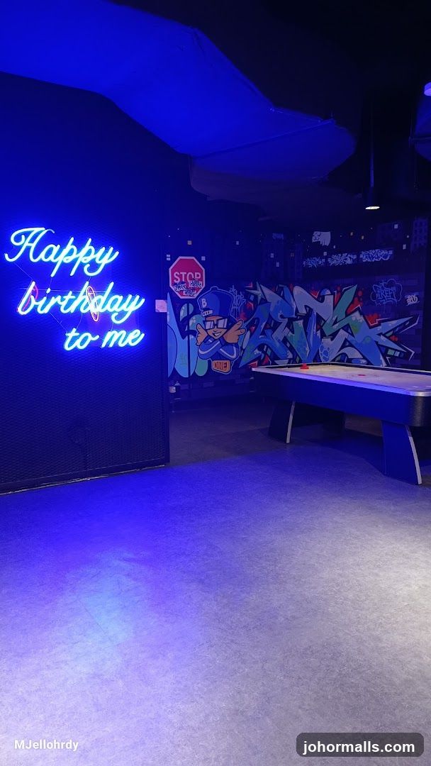 Indoor Gaming Area with Neon Signage