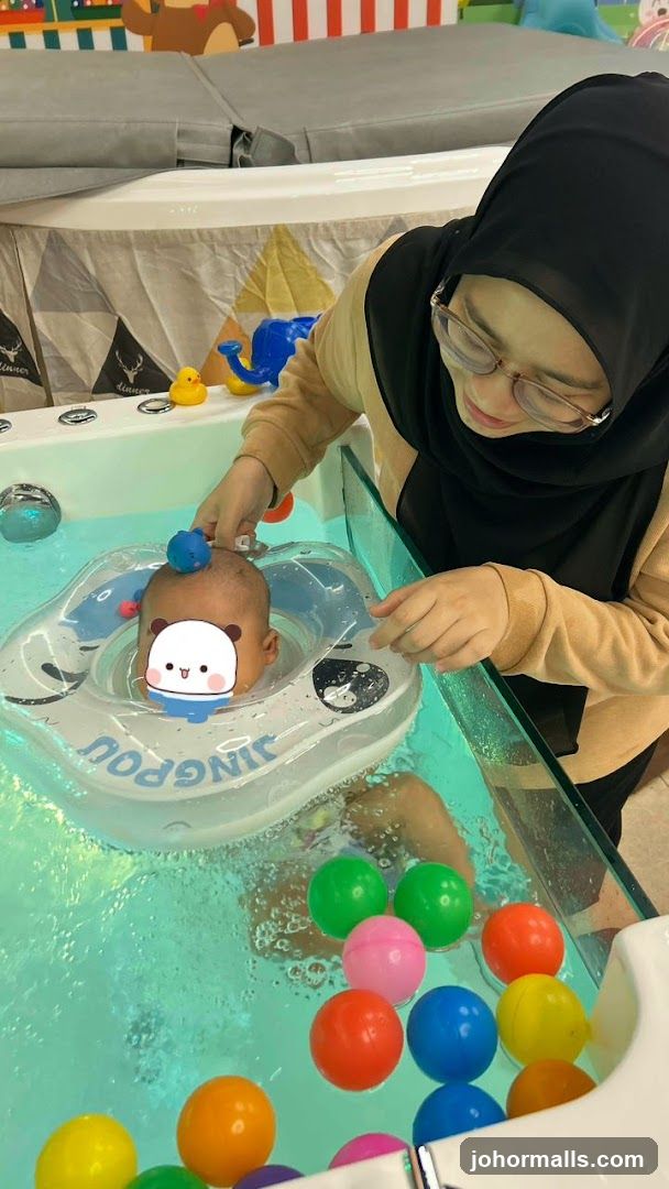 Baby in water play area