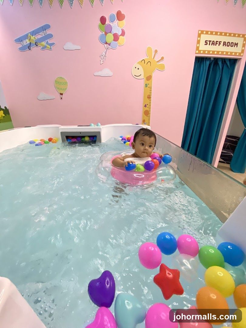 Baby in indoor play pool