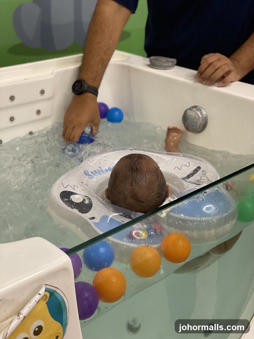 Baby in water play tub