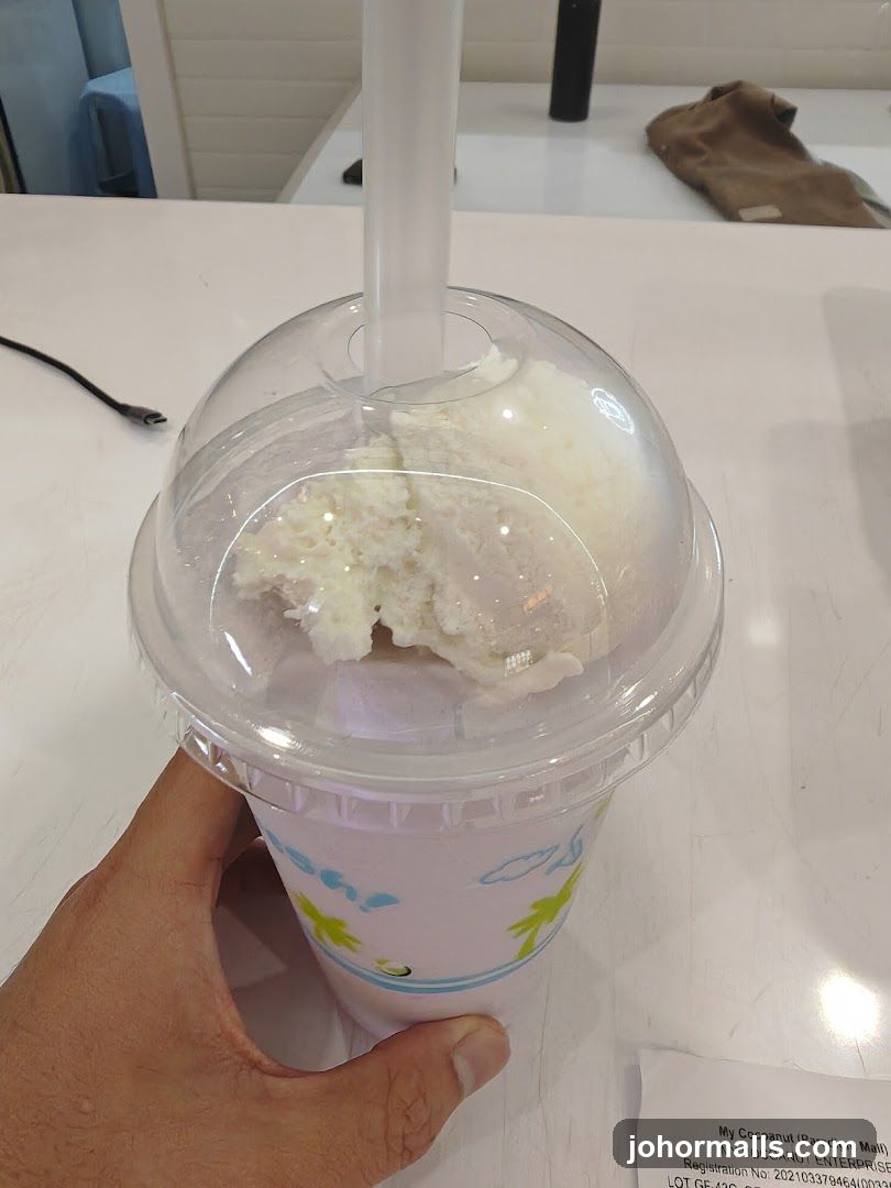 Hand holding a drink cup
