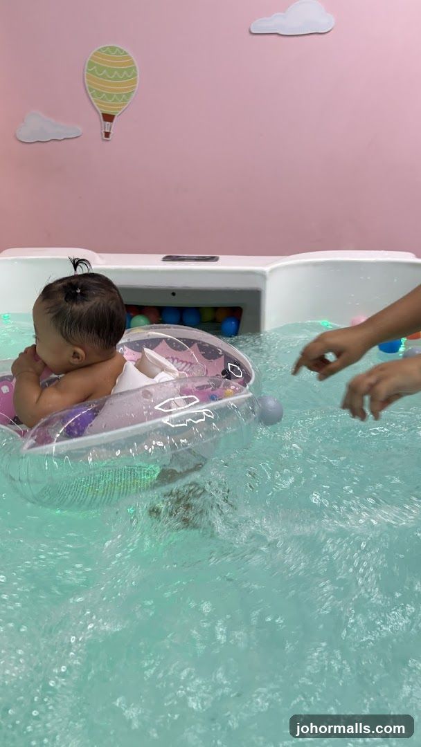 Baby in indoor pool