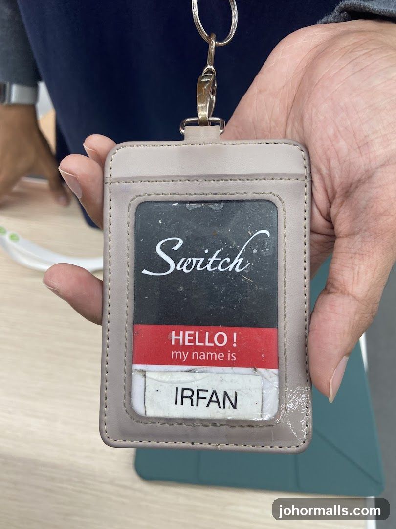 Hand Holding ID Badge
