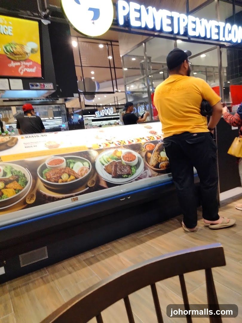 Food court interior with customer at counter