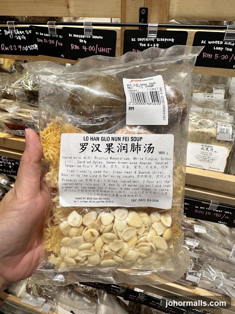 Hand holding packaged herbal soup