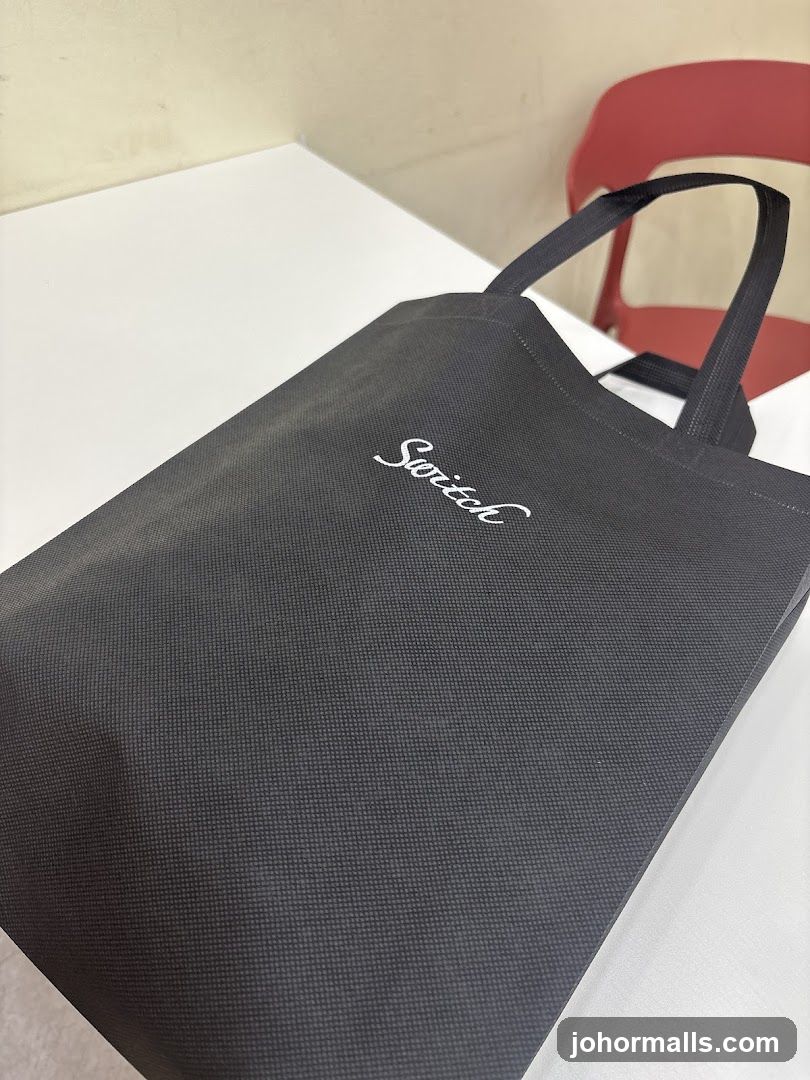 Black tote bag with 'Switch' logo