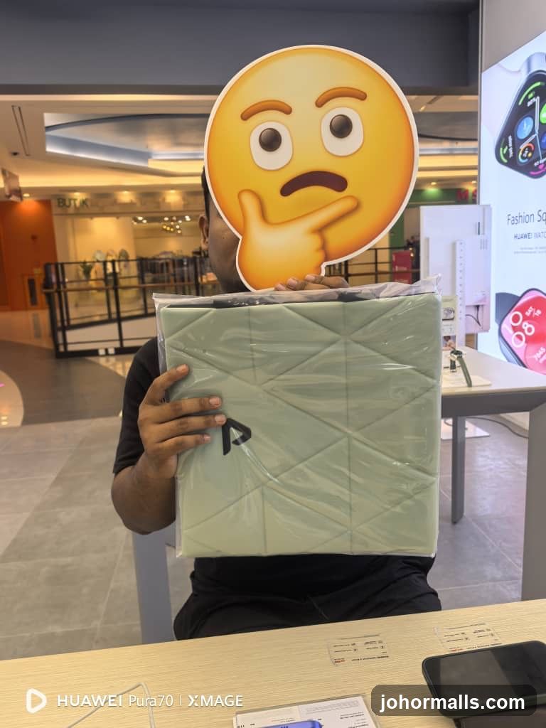 Person holding product with emoji cutout