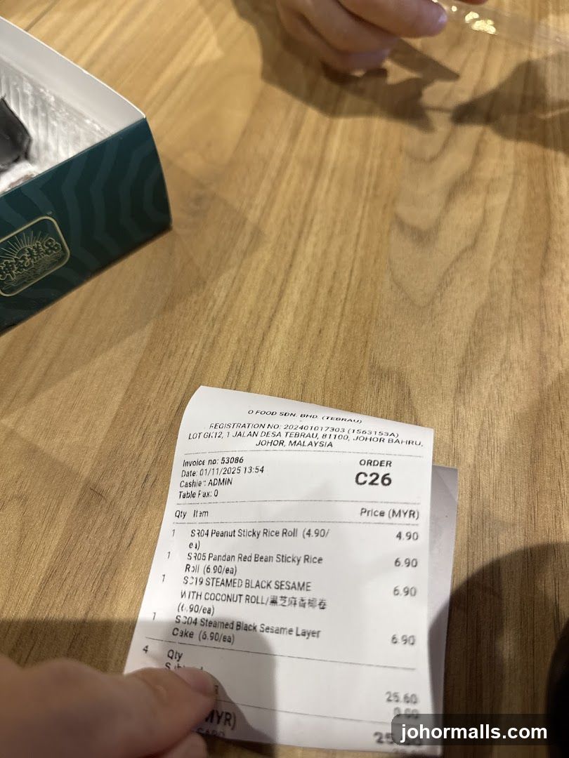 Receipt and Box on Wooden Table