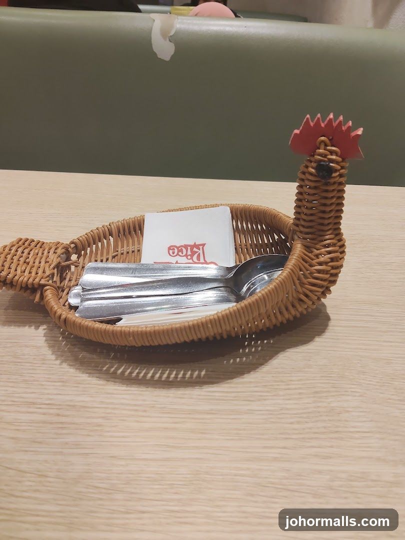 Rooster-shaped utensil basket on table