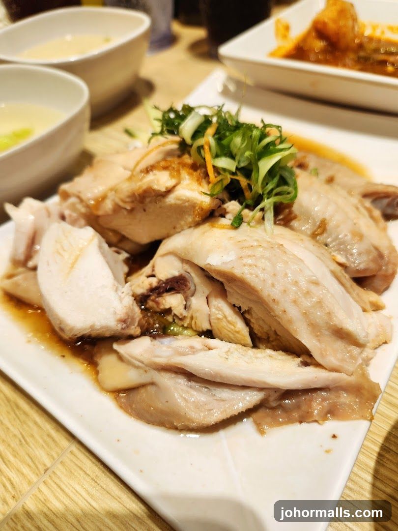 Dish of sliced chicken with garnish
