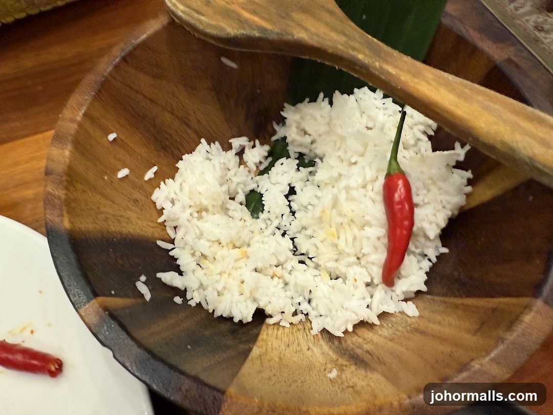 Rice with chili in wooden bowl