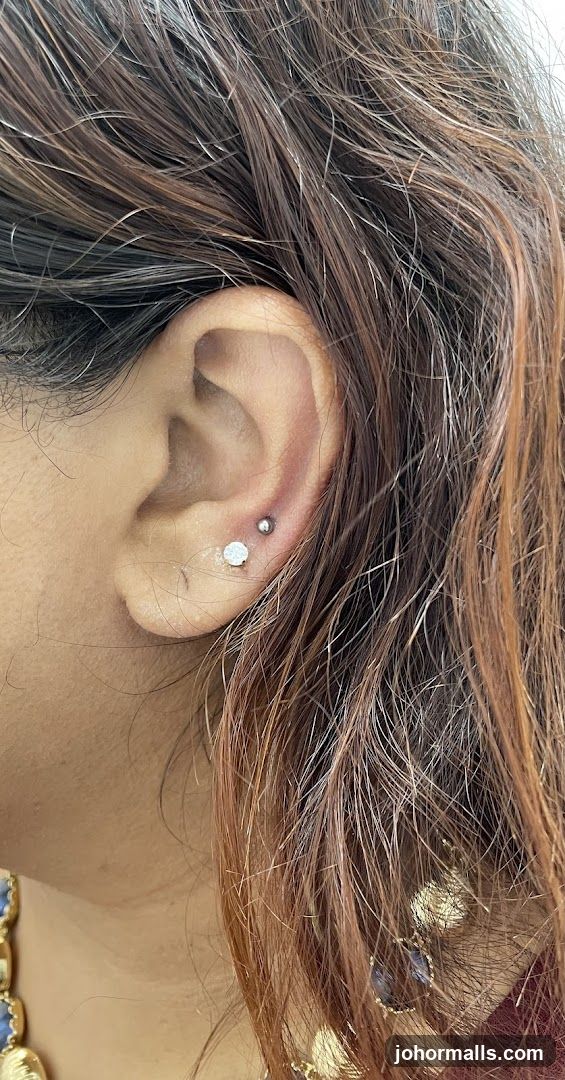 Close-up of ear with earrings