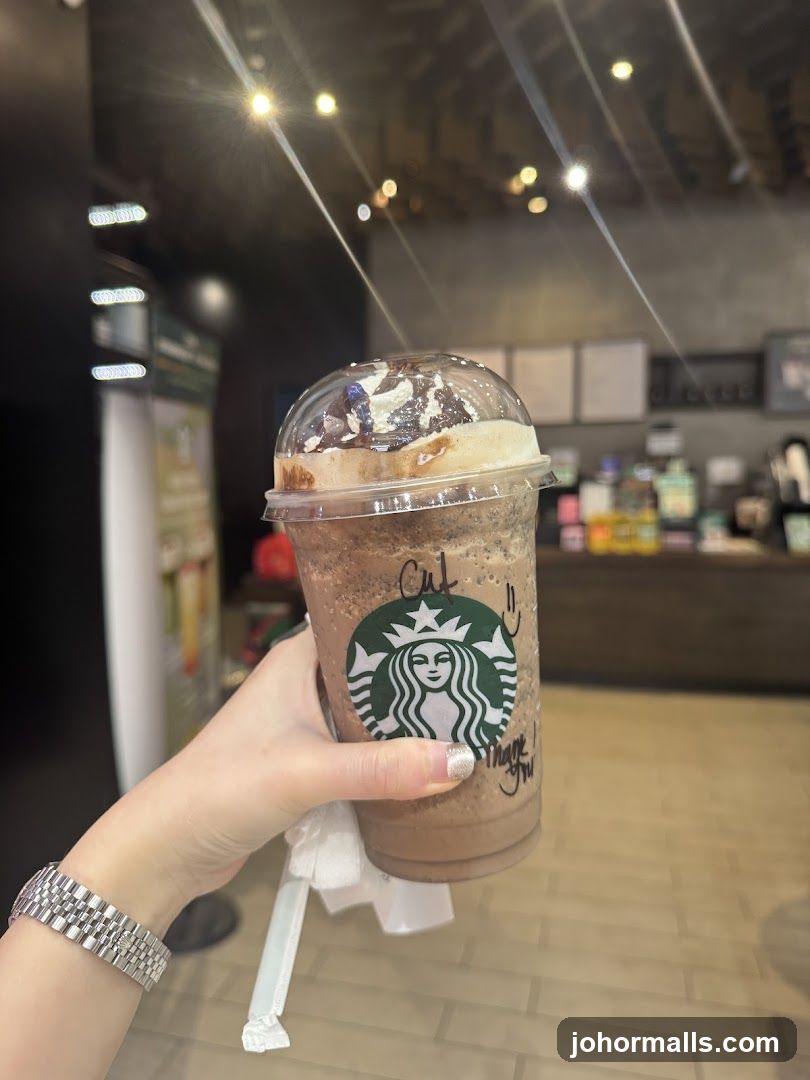 Starbucks beverage held in hand