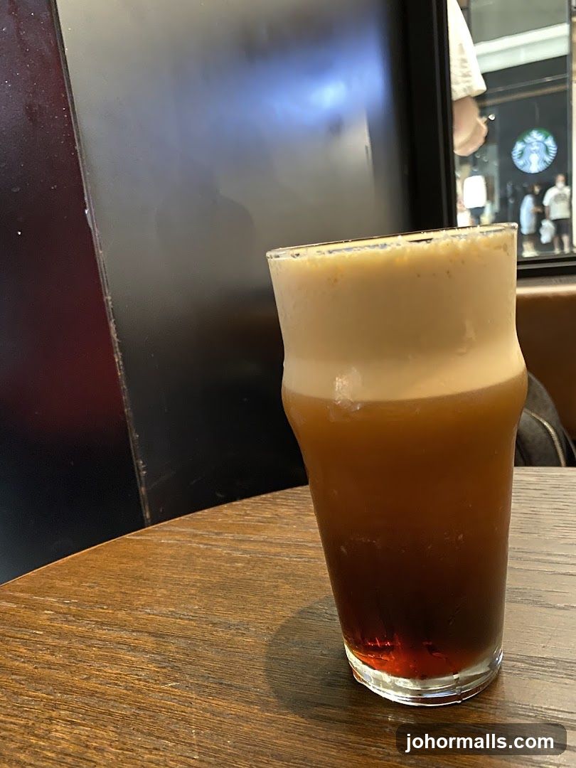Coffee in a glass on wooden table