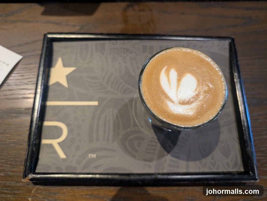 Coffee with latte art on branded tray