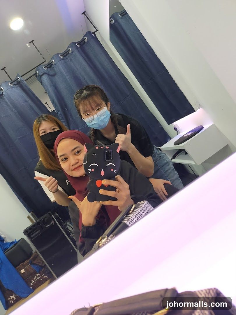 Group selfie in interior space