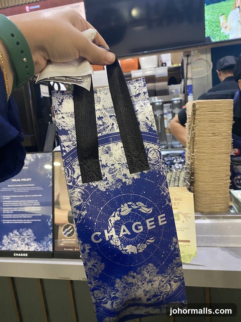 Chagee branded bag held by customer