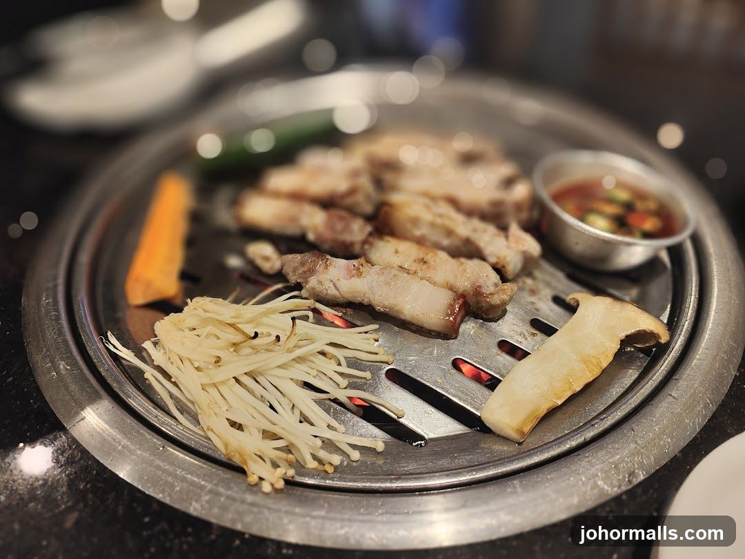 Grilled meat and vegetables on a Korean BBQ grill