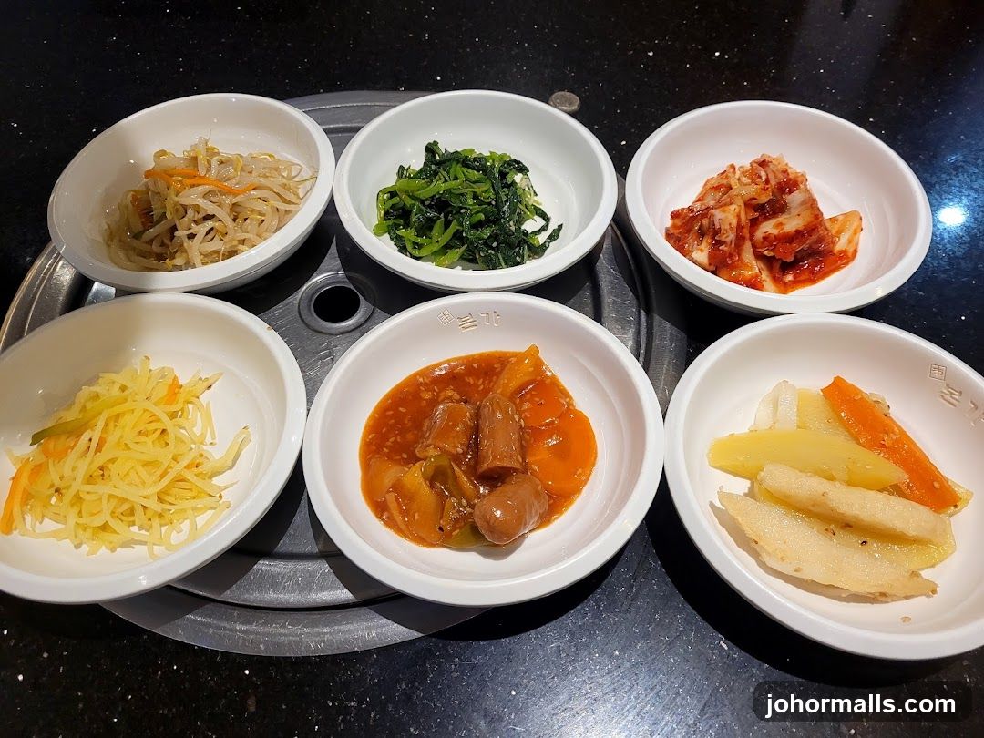 Korean side dishes served on a grill table
