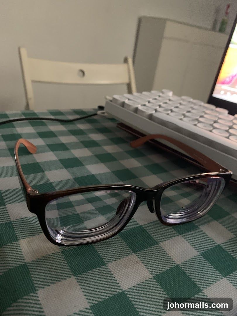 Glasses on Table with Keyboard and Chair