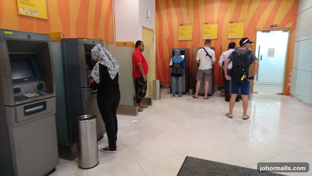 People using ATMs