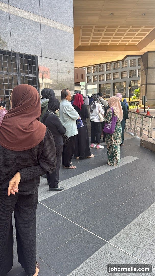 People queuing outside a building