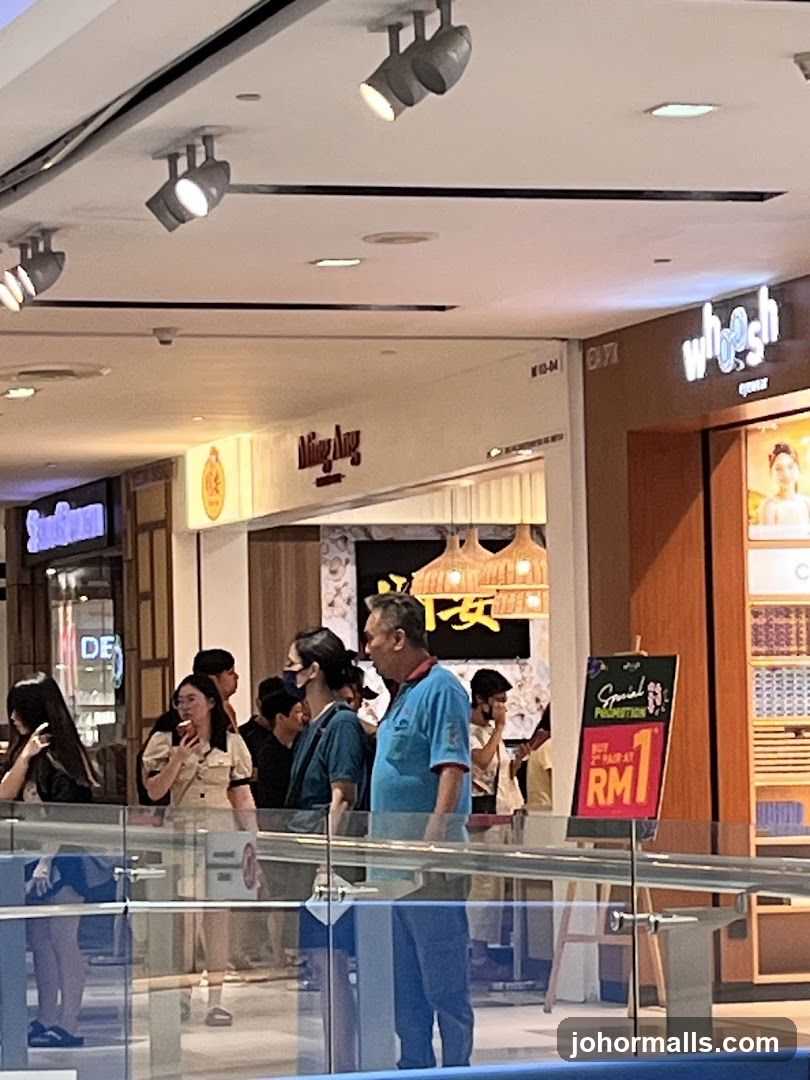Mall Interior with Shoppers and Signage