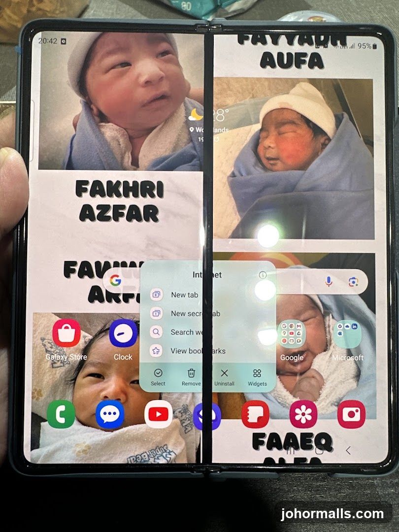 Phone screen with baby photos and names