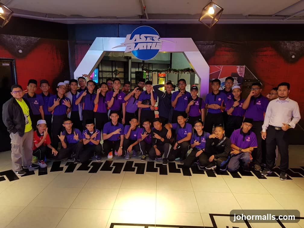 Group posing in front of Laser Battle entrance