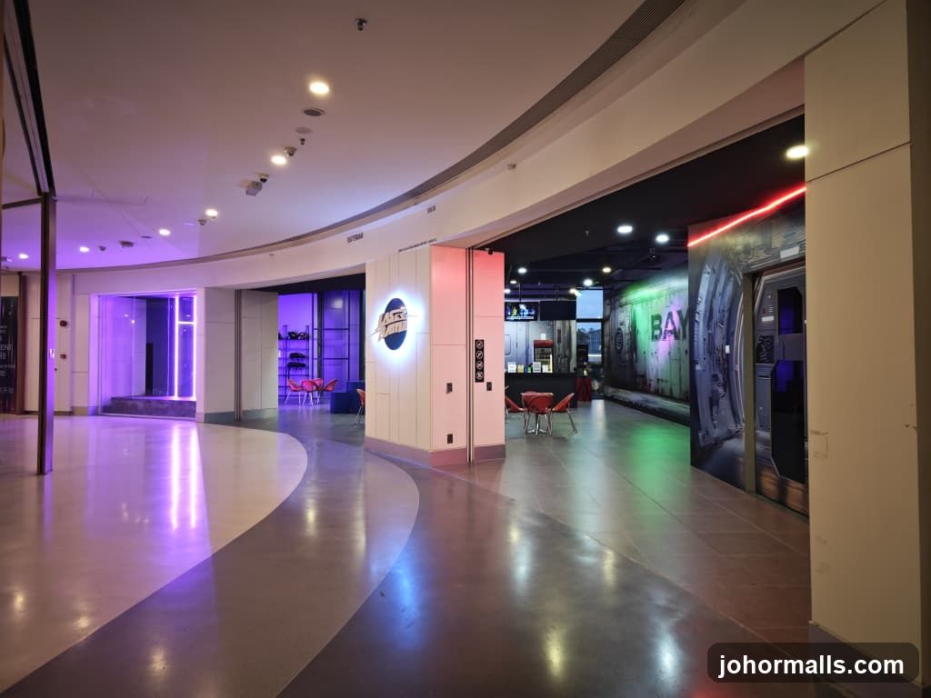 Indoor mall corridor with futuristic themed attractions
