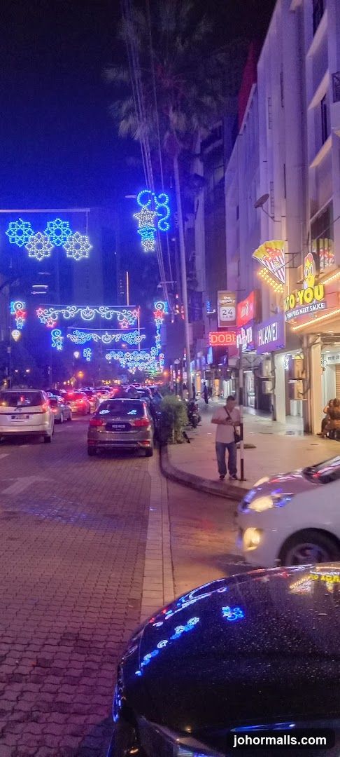Street decorated with lights at night