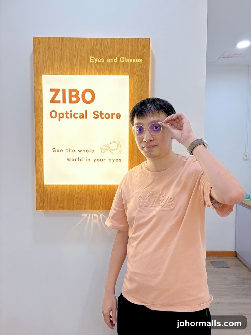 Man in front of ZIBO Optical Store sign