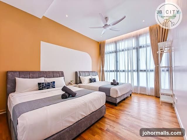 Bedroom with two beds and large windows