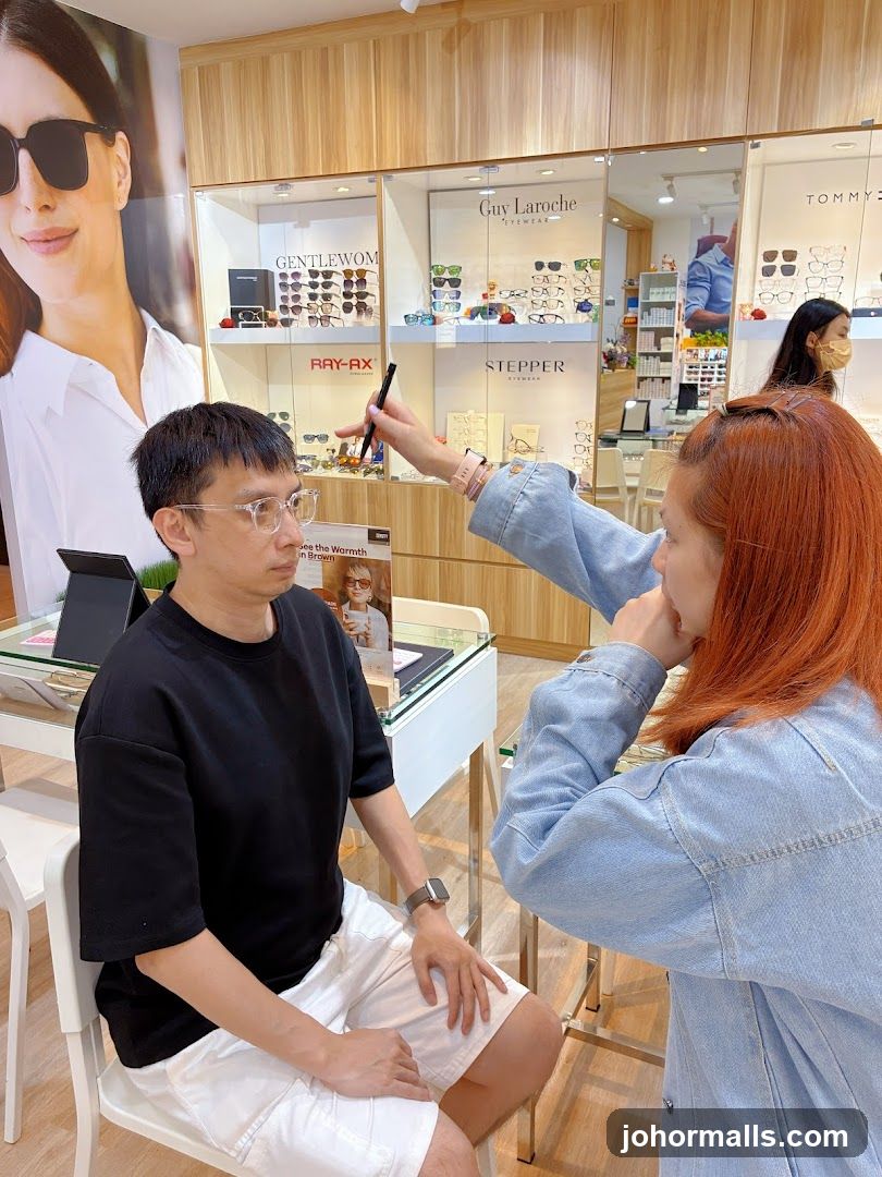 Optician assisting customer