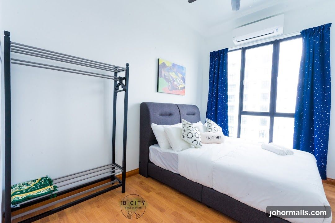 Bedroom with a bed and clothing rack