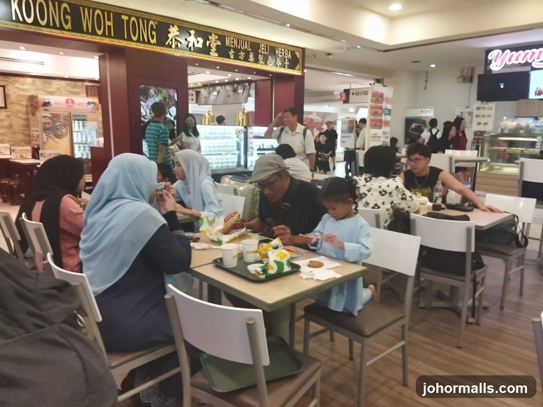 People eating at tables in a food court