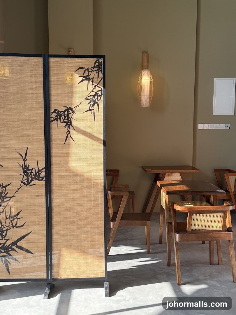 Interior of a cafe with bamboo screen and wooden furniture