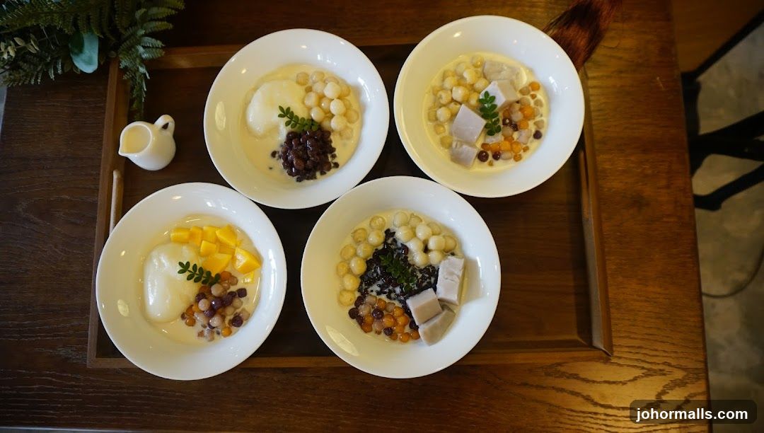 Four bowls of dessert with various toppings