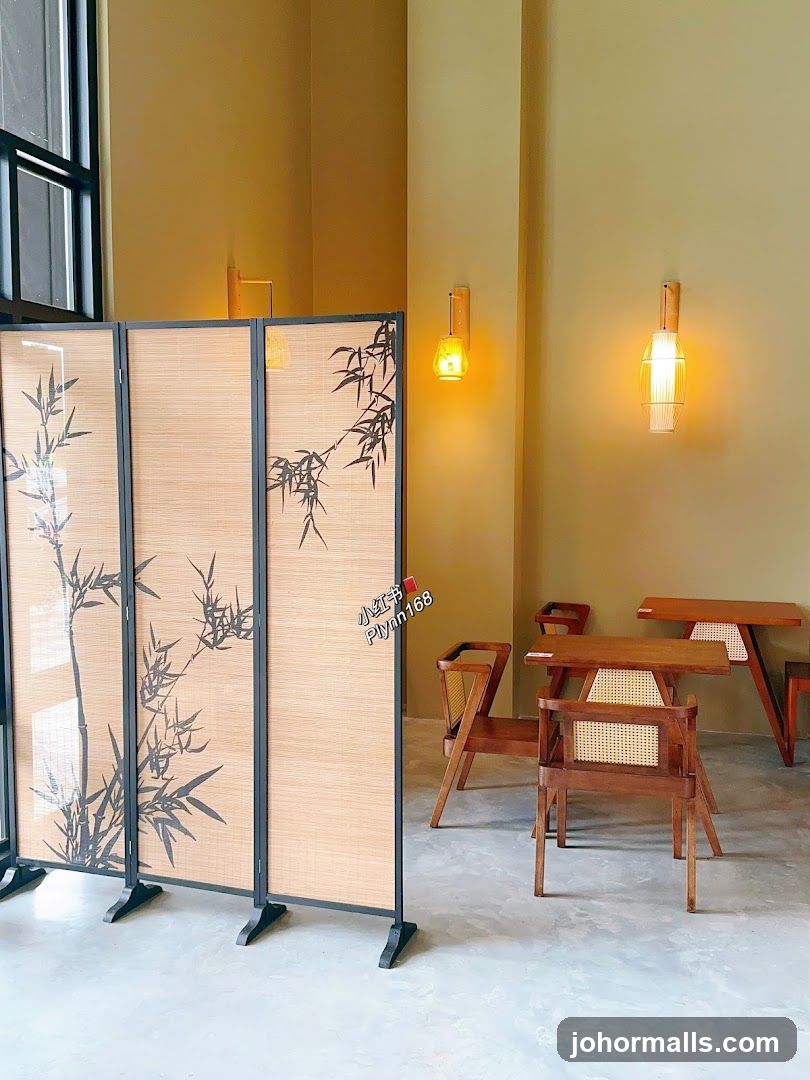 Interior of a cafe with bamboo screen and wooden furniture