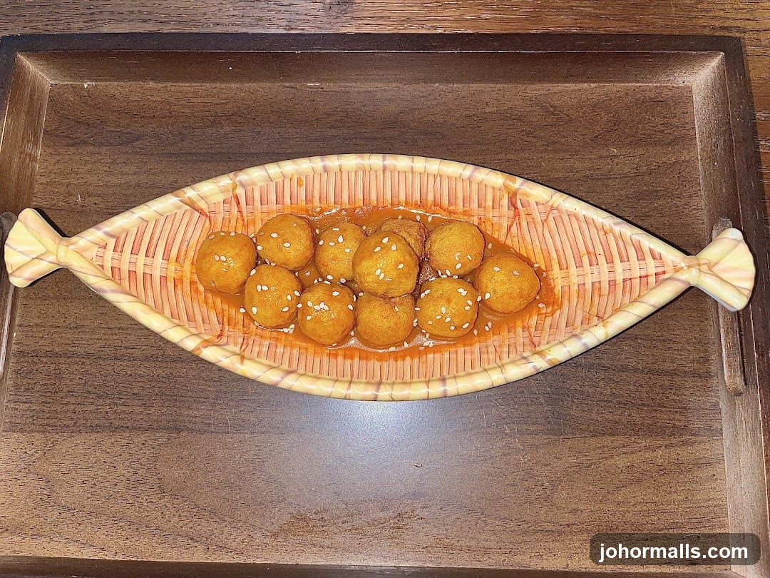 Fish-shaped bowl of meatballs