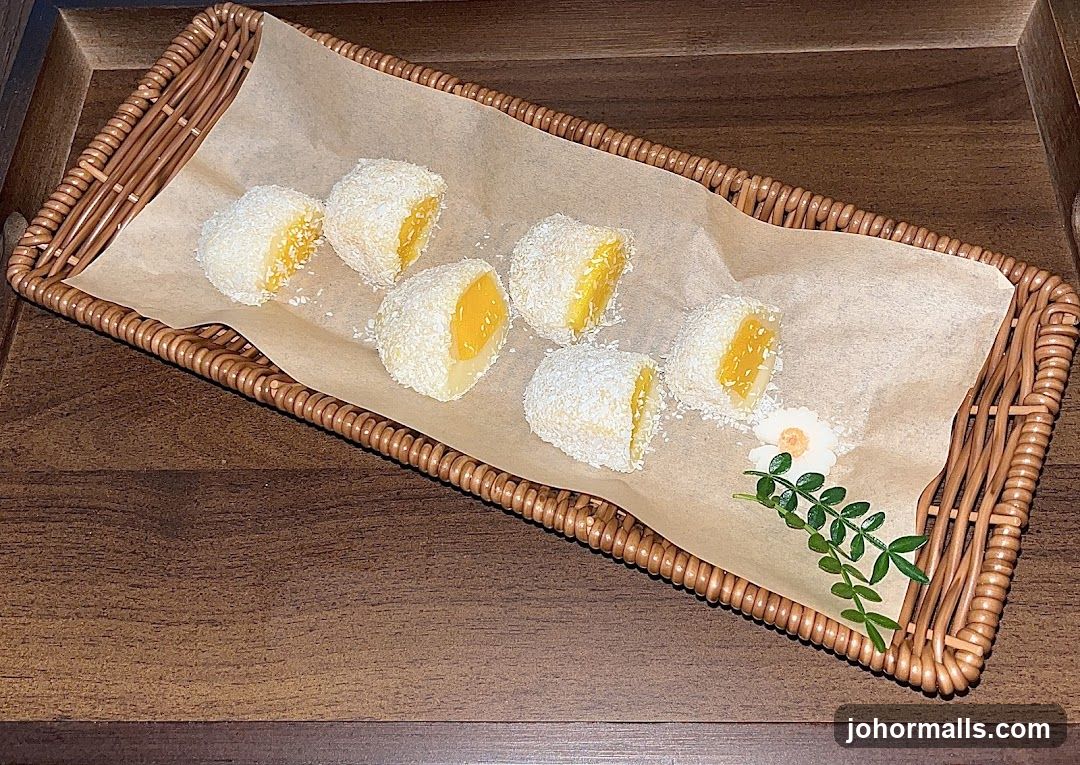 Coconut-covered mochi with mango filling