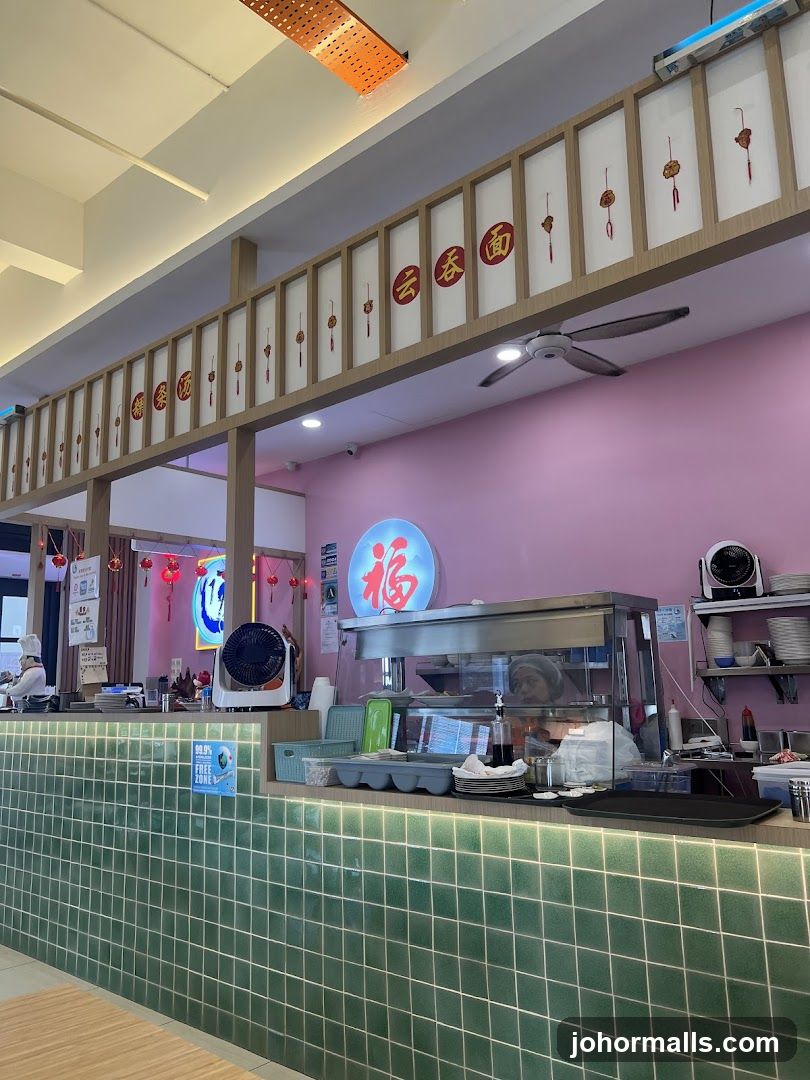 Restaurant Interior with Pink Walls and Green Tiled Counter